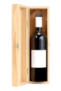 Open wooden wine box with a bottle of red wine inside isolated on white background with clipping path and copy space for your text Royalty Free Stock Photo