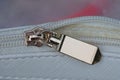 open yellow metal zip on a white leather bag Royalty Free Stock Photo