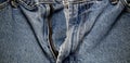 Open zipper on old faded jeans Royalty Free Stock Photo