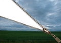 Open zipper showing a bright sky and a heart shaped cloud