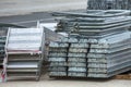 Openair storage of galvanized steel and aluminum frames, ladders, and ringlock scaffolding systems for many applications on Royalty Free Stock Photo
