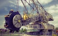 Opencast brown coal mine. Excavator SchRs-315. Extractive industry Royalty Free Stock Photo