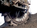 Opencut coalmine dredger operating a bucket wheel to dig coal.