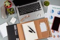 Opened agenda near laptop and modern gadgets on a grey close up Royalty Free Stock Photo