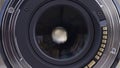 Opened aperture of a professional camera lens, close up. Opened camera lens diaphragm, front view, photography concept.