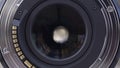 Opened aperture of a professional camera lens, close up. Opened camera lens diaphragm, front view, photography concept.