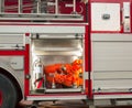 Fire hose extingisher bay on fire truck Royalty Free Stock Photo