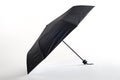 Opened black umbrella isolated on white background Royalty Free Stock Photo