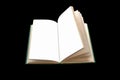 Opened book close-up on a black background. Royalty Free Stock Photo