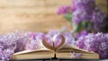 Opened book on the table with pages like heart and flowers Royalty Free Stock Photo