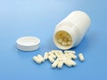 Opened bottle acidophilus capsules Royalty Free Stock Photo