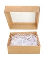 Opened brown cardboard gift box with shredded paper isolated