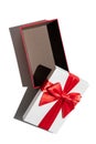 Opened brown gift box with lid and red ribbon isolated on white Royalty Free Stock Photo