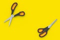 Opened and closed scissors on yellow background. Barber equipment. Stationery accessories Royalty Free Stock Photo