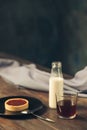 Opened craft paper envelope , autumn leaves and coffee on wooden table