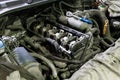 opened diesel internal combustion engine durnig repair inside engine compartment of SUV