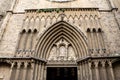 An entrance to the church as an element of gothic archetecture in Spain, Barcelona. Old ancient bas lica made of stone opened from
