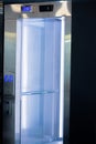 Opened elevator doors. Modern elevator with a mirror inside Royalty Free Stock Photo