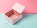 Opened, empty cardboard box isolated on a pink and blue background. Designed for gifts and inscriptions Royalty Free Stock Photo