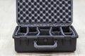 Opened empty plastic case for photo equipment with dividers