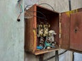 Opened, exposed  electrical box of an old abandoned building Royalty Free Stock Photo