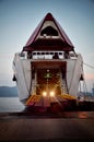 Opened ferry with the lights of car waiting for landing. Portoferraio, Elba Island. Royalty Free Stock Photo