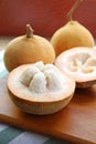 Opened Fresh Ripe Santol Fruit or Cotton Fruit with Whole Fruit Royalty Free Stock Photo