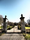 Opened gates of the entrance of the park during daytime