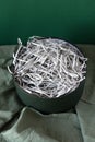 Opened gift box with decorative straw, filler, shavings, paper ribbons. Cut paper for packaging. Decorative biodegradable filler, Royalty Free Stock Photo