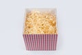 Opened gift box with decorative straw, filler, shavings. Top view, empty giftbox isolated on white, mockup for design Royalty Free Stock Photo