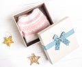 Opened gift box with knitted sweater Royalty Free Stock Photo
