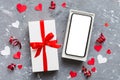 Opened gift box with ribbon and phone on color background, top view. Blank open box packaging mockup , Template for your Royalty Free Stock Photo