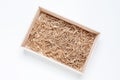 Opened gift wooden box with shredded paper filler on white background for product placement Royalty Free Stock Photo