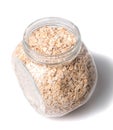 Opened glass jar with rolled oats isolated on white background glass jar with oatmeal flakes isolated