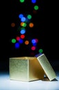 Opened golden box with bokeh