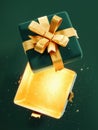 Opened green empty Christmas gift box with golden bottom on green background.