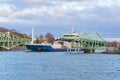 Opened green swing bridge with two rotating parts. Ship coming through canal Royalty Free Stock Photo