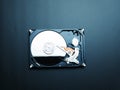 Opened hard drive disk on dark background. Royalty Free Stock Photo