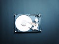 Opened hard drive disk on dark background. Royalty Free Stock Photo