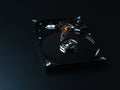 Opened hard drive disk on dark background. Royalty Free Stock Photo