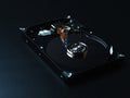 Opened hard drive disk on dark background. Royalty Free Stock Photo