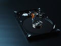 Opened hard drive disk on dark background. Royalty Free Stock Photo