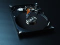 Opened hard drive disk on dark background. Royalty Free Stock Photo