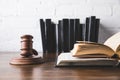 opened juridical books with gavel on wooden table, Royalty Free Stock Photo