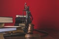 opened juridical books with lady justice statue and gavel on wooden table,