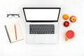 Opened laptop with isolated screen on white desk Royalty Free Stock Photo