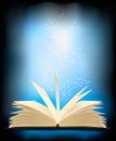 Opened magic book with magic light. Royalty Free Stock Photo