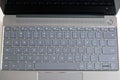 Opened modern laptop keyboard with USA alphabet on keys front top view closeup