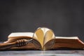 Opened old book with hart shaped from two pages Royalty Free Stock Photo