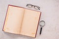 Magnifying glass and opened old book Royalty Free Stock Photo